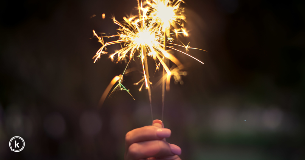 woman's hand holding a sparkler