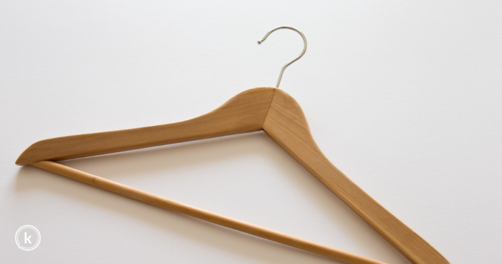 Wooden hanger on a white background