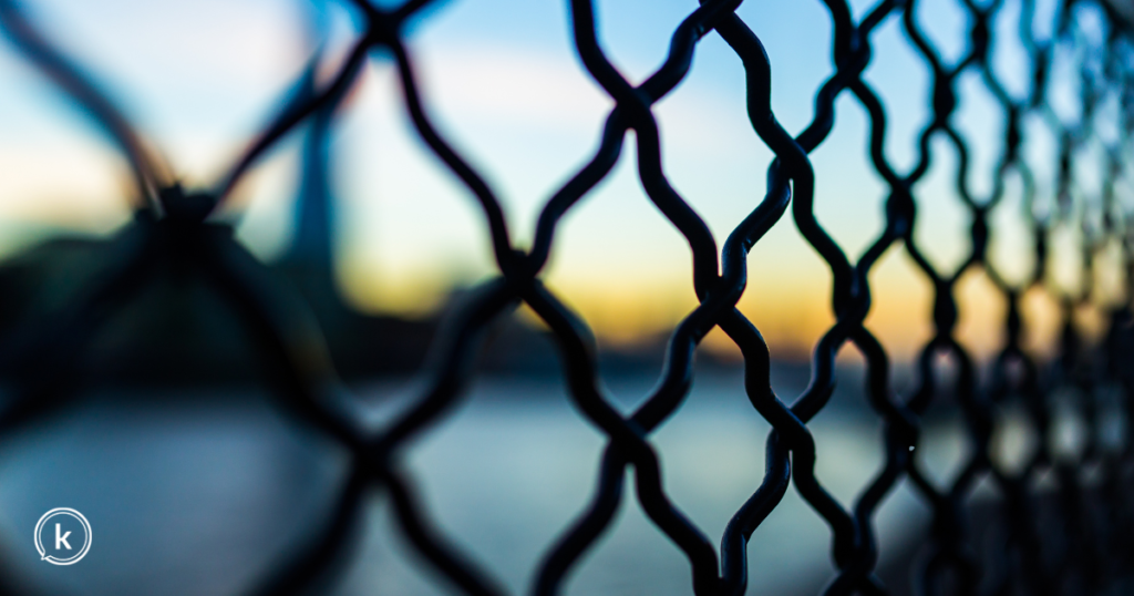 Chain link fence with blue background